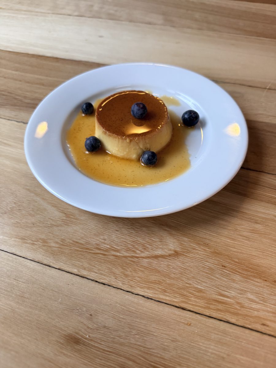 Home-made flan with caramel and blueberries