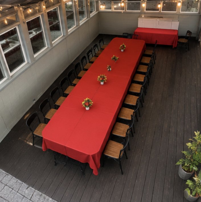 Aerial view of a long banquet table set for a private dinner