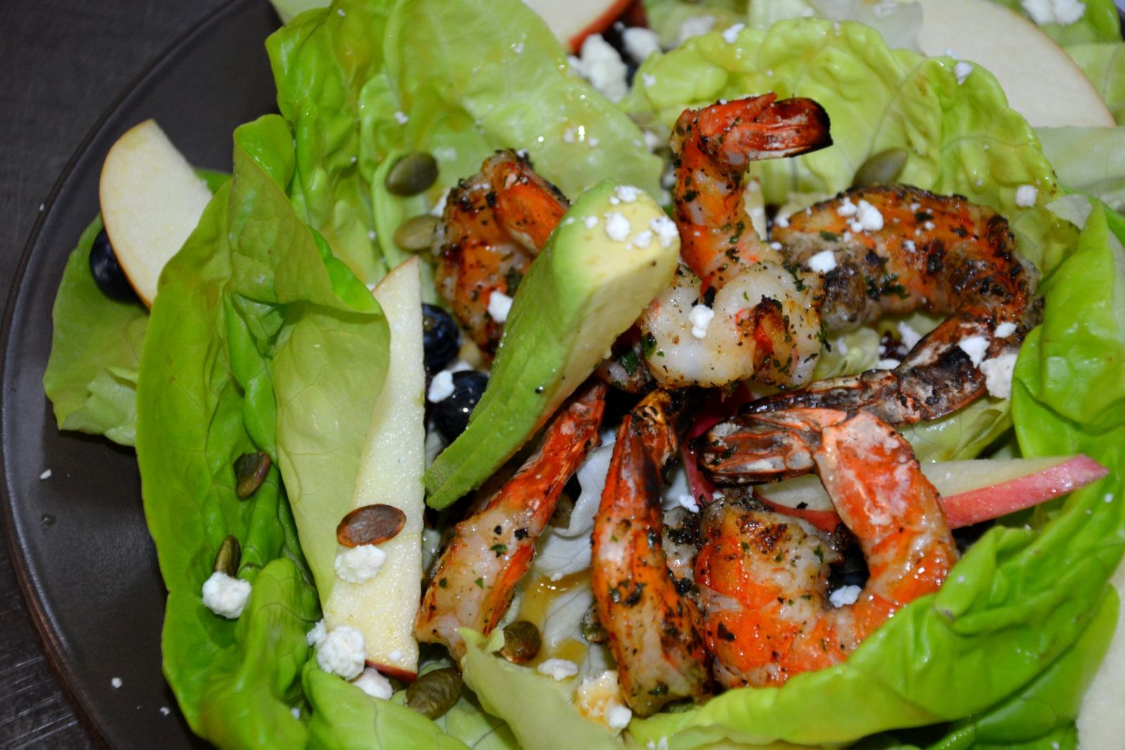 Butter lettuce salad with grilled prawns, avocado, apple and feta