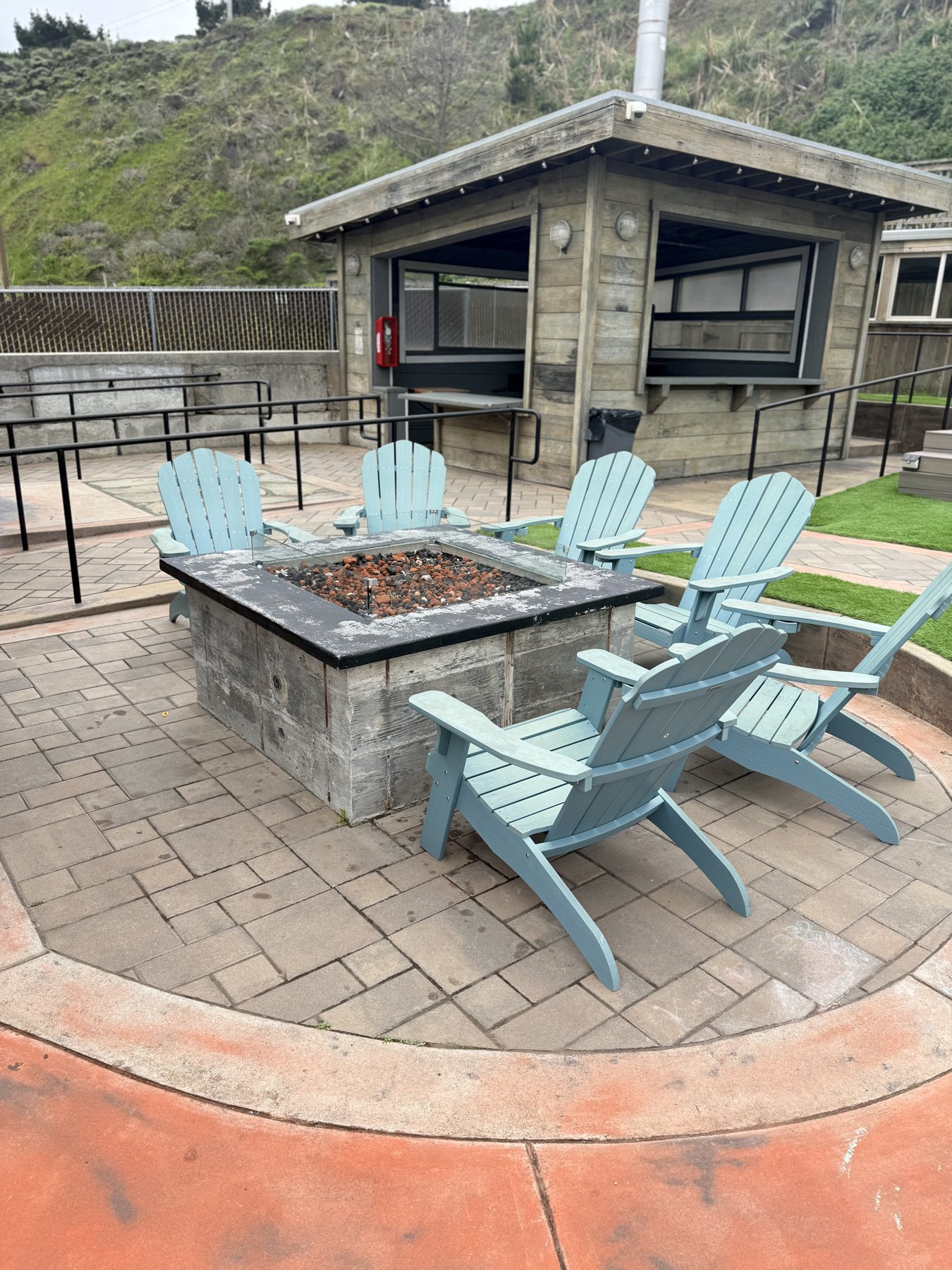 Fire pit lounge with adirondack chairs